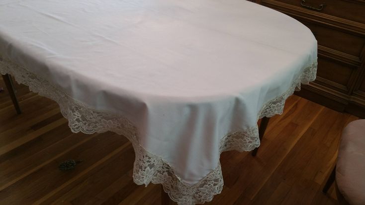 a white table cloth on a wooden floor