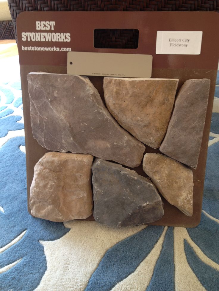 a box with several rocks in it on the floor