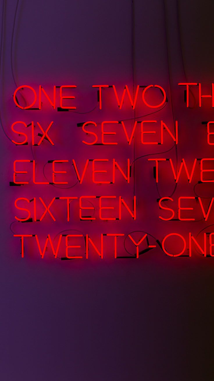 a red neon sign that says one two the six seven eleven seven seven seven twenty