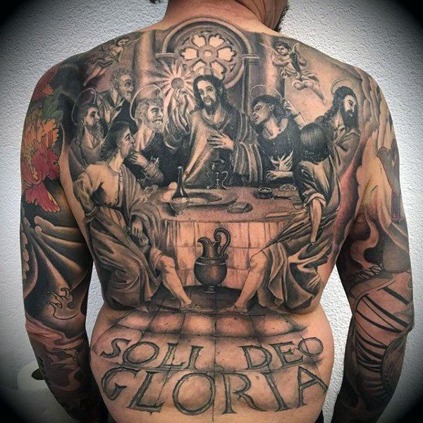 the back of a man with tattoos on his body