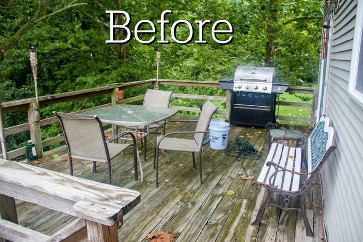 an outdoor deck with table and chairs on it