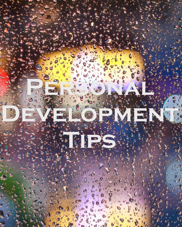 the words personal development tips written on a rainy window