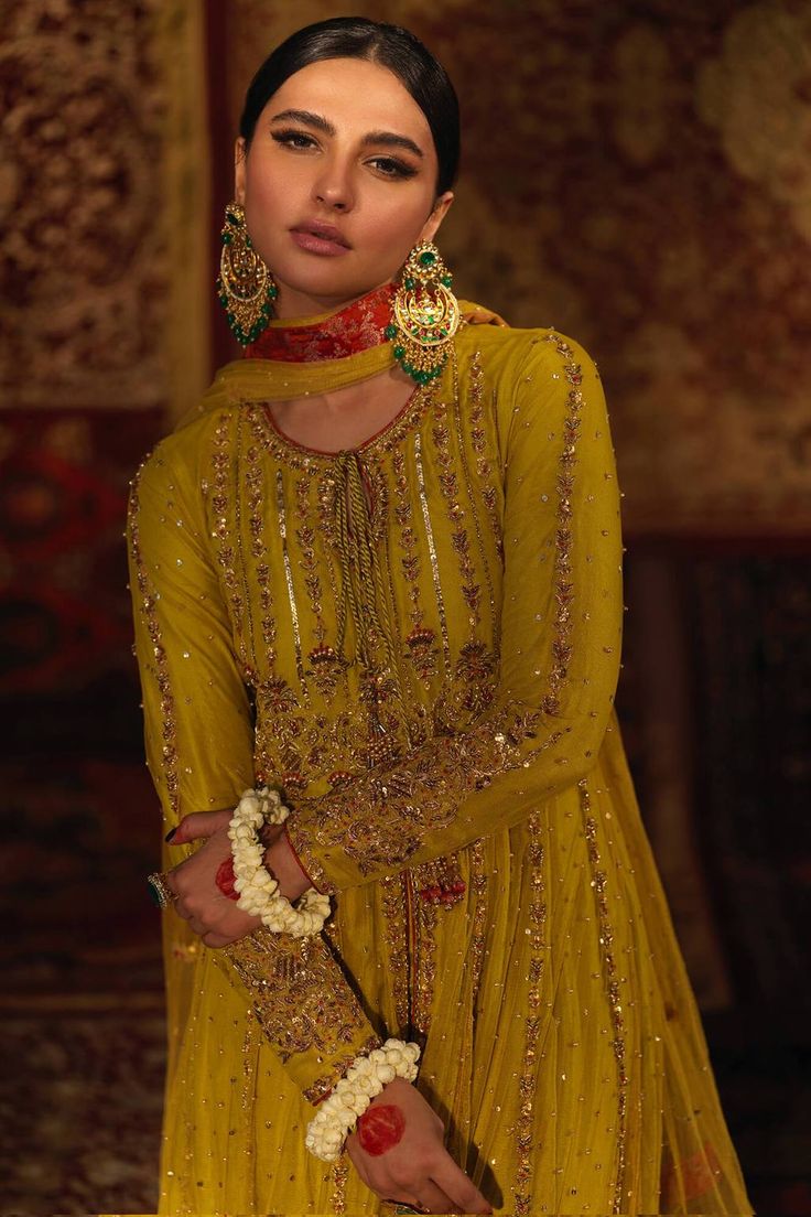 Azal (100% Advance Payment)– Zaaviay Pakistani Dholki Outfit, Gold Anarkali Set For Eid, Embellished Yellow Sharara For Eid, Yellow Embellished Anarkali Set With Traditional Drape, Gold Sharara With Gold Embroidery For Festivals, Gold Embroidered Sharara For Festivals, Gold Dupatta For Reception And Festivals, Festival Gold Sharara With Gold Embroidery, Yellow Raw Silk Dress For Wedding