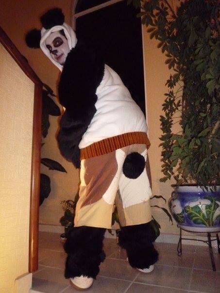 a person in a panda costume standing on the floor