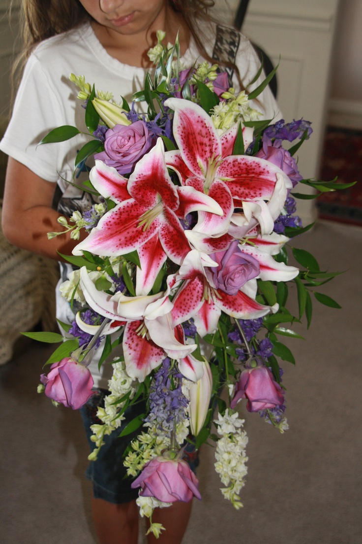 Stargazer lily and rose cascading bouquet. Stargazer Bouquet, Stargazer Lily Bouquet, Cascading Bouquet, Lily Bouquet, Stargazer Lily, Roses Bouquet, Cascade Bouquet, School Dance, School Dances