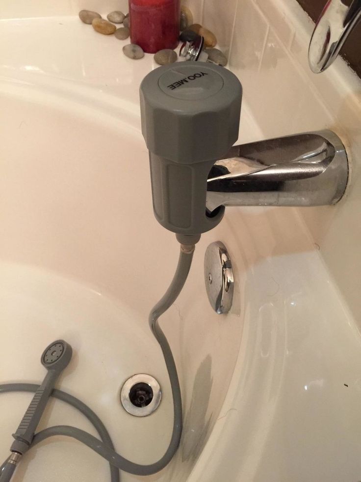 a faucet that is connected to the side of a sink