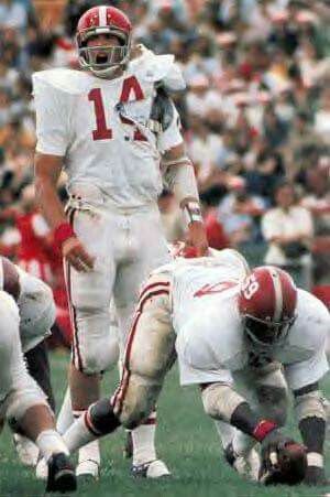 a football player holding the ball during a game