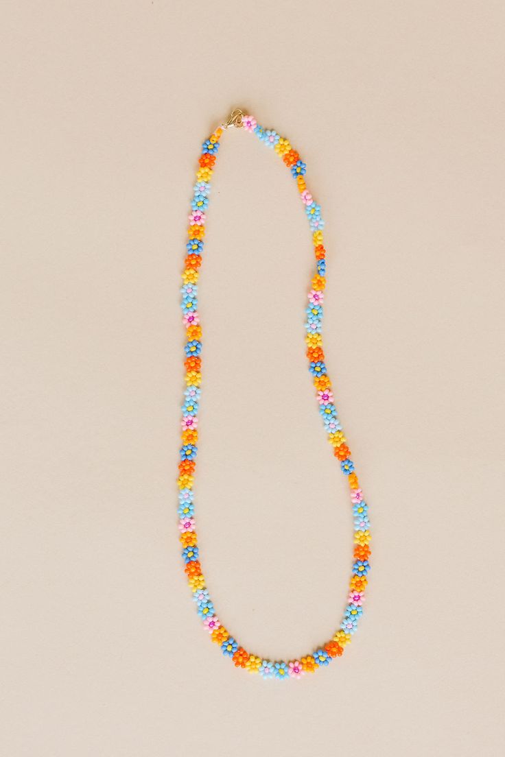 Nothing like a little daisy chain that lasts a lifetime. The Zara is hand beaded with so much love. One of our original necklaces, we always recommend Zara for a layered look, casual or dressed up, she's a perfect faux choker for everyday wear. Available in summer daisy: our combination of blue, pink, and yellow flowers with varying centers to create a bright poppy combination of flowers. - 3D Daisy chain necklace - 14k Gold fill lobster clasp - Handmade in Mexico - 17" Length 5mm width Summer Everyday Beaded Jewelry, Daisy Chain Necklace, Zara Necklace, Diy Friendship Bracelets Tutorial, Pink And Yellow Flowers, Flowers 3d, Original Necklace, Friendship Bracelets Tutorial, Bracelets Tutorial