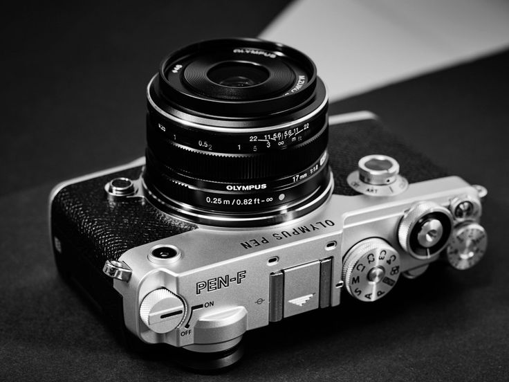 a black and white photo of a camera with the lens on it's body