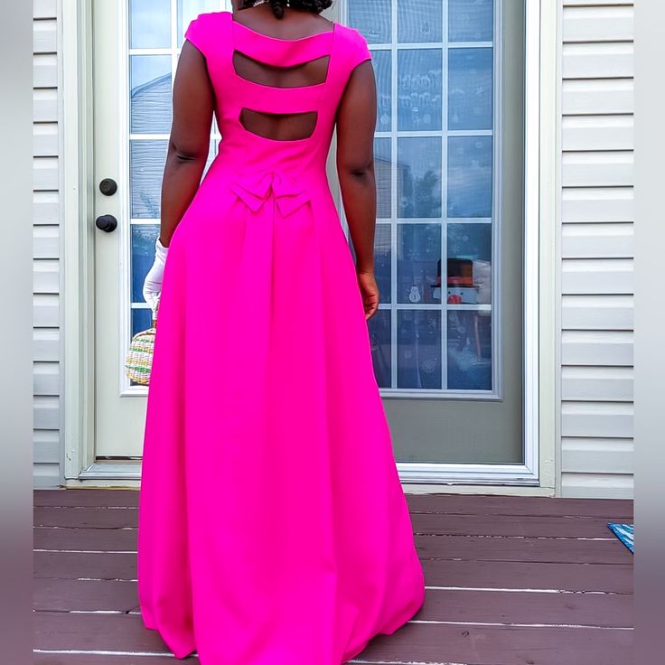 Absolutely Stunning Vintage Fuchsia Circle Princess Cut Maxi Cocktail Dress. Features *Cup Sleeve Bodice * Bias Cut Full Sweep Fuchsia Rayon Blend * Peek Back Neck And Waist Bow *Back Neck Ribbon Tie *Side Invisible Zipper ** Full Lined Unused Dress In Mint Condition. *Has Inner Puff Netting For Volume Measurements Bust 34" Waist 28-30" Hips Bias Cut Curcle Free Length 60". Shipping Will Be Ship 2 Business Days After Purchase Pink Fitted A-line Gown, Pink A-line Evening Dress With Fitted Bodice, Pink A-line Evening Gown, Pink A-line Gown For Evening, A-line Maxi Dress With Back Opening For Party, Pink Pleated Bodice Maxi Dress For Prom, Pink A-line Gown With Fitted Bodice, Pink Long Dress With Pleated Bodice, Pink Dress With Pleated Bodice