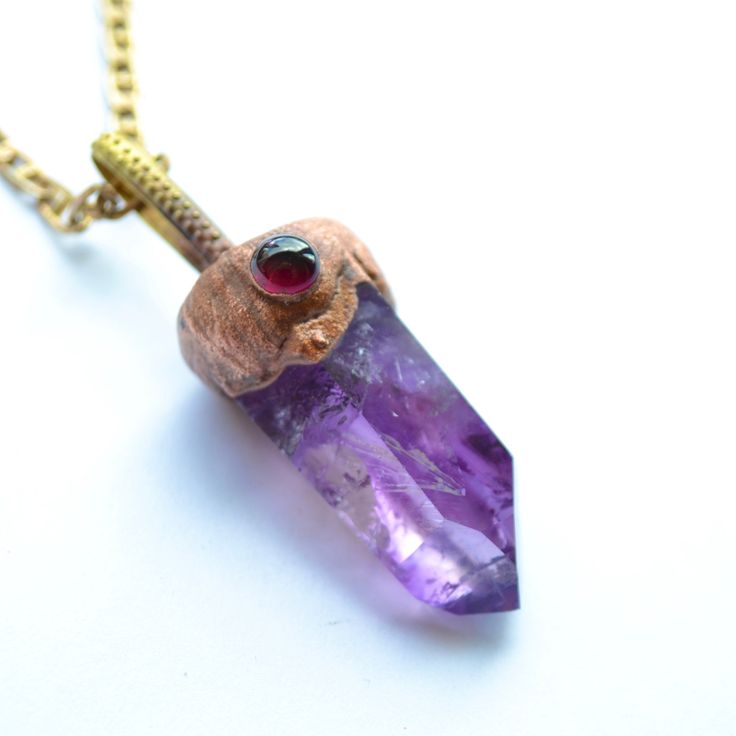 Amethyst and garnet pendant Precious stone necklace Boho jewelry  Amethyst necklace Enchanted forest jewelry gift for mom, for grandma   AMETHYST Amethyst is known as the stone of harmony, transmutation and spirituality. She corresponds to the 6th chakra, located between the eyebrows. She helps calm the mind and relax us, thus promoting the connection with our intuition. It is for this reason that amethyst is usually a good complement to the practice of meditation, either holding the mineral in Spiritual Necklaces With Natural Stones For Gifts, Unique Birthstone Necklace Gift, Unique Birthstone Necklace For Gift, Unique Amethyst Jewelry With Gemstone Accents, Unique Birthstone Gemstones As Gifts, Unique Birthstone Pendant Necklace, Crystal Gemstone Pendant Necklace Gift, Spiritual Natural Stones Necklaces For Her, One Of A Kind Amethyst Jewelry Gift