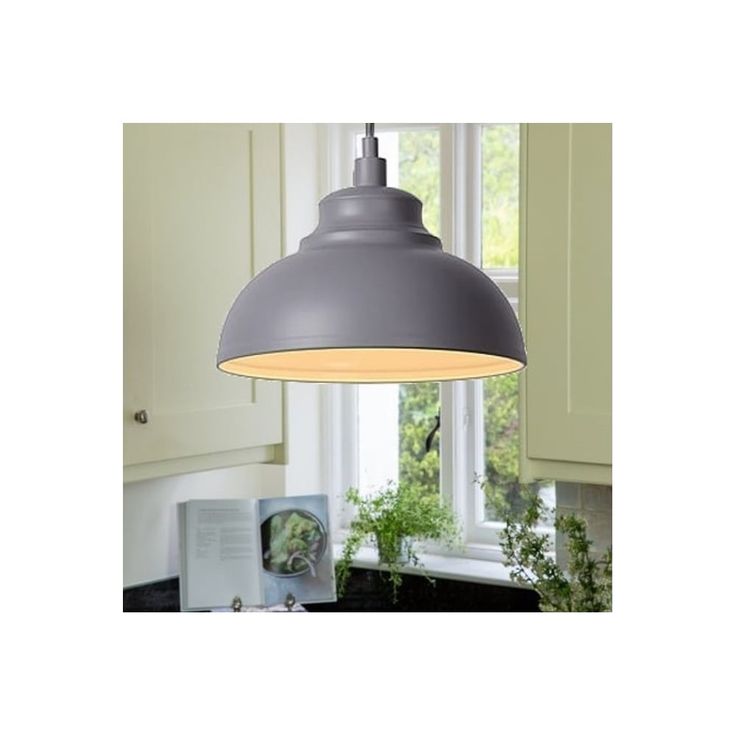 a gray light hanging over a kitchen counter