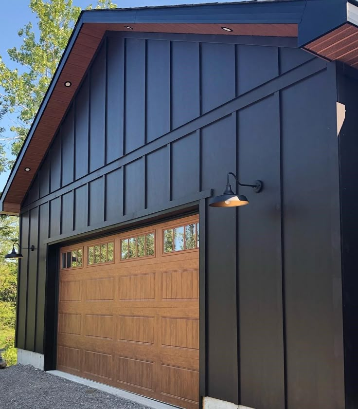 a large garage with two doors on the front and one door open to let in light