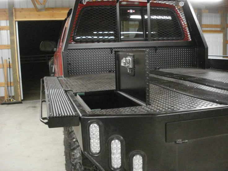 the back end of a pickup truck in a garage