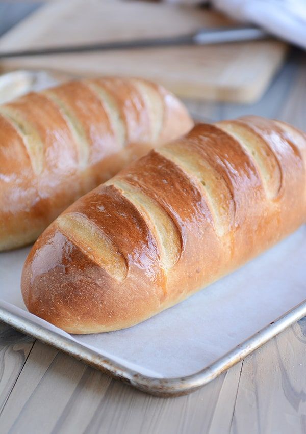 two loaves of bread sit on a plate