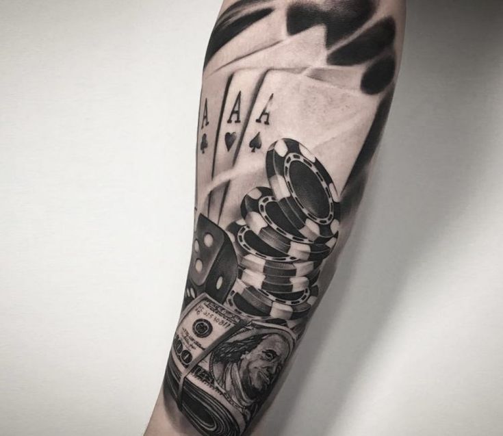 a man's arm with poker cards and money on it