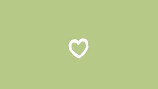 a white heart on a green background