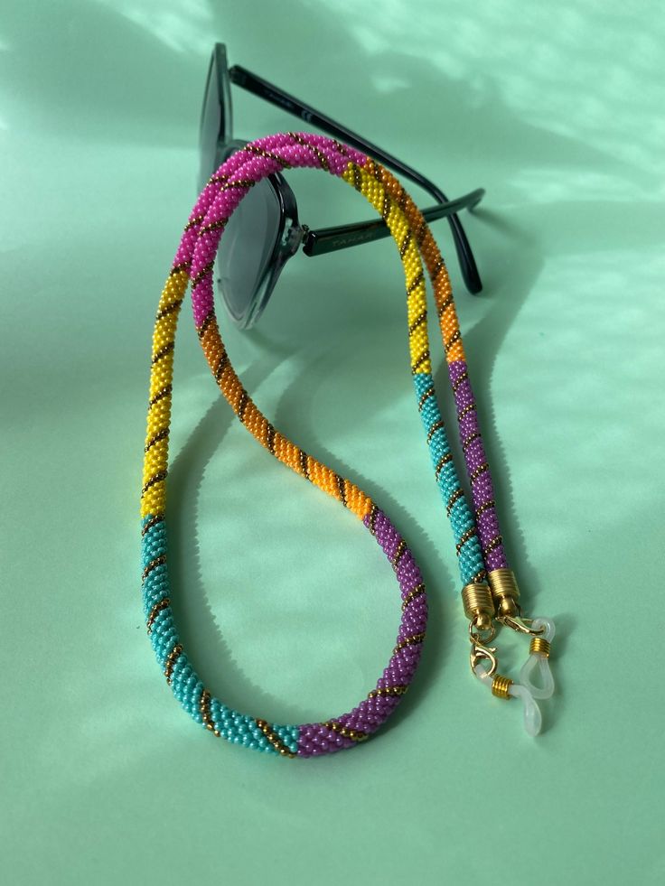 The perfect accessory for your wardrobe, adding a finishing touch to your outfit. Multi-functional glasses, sunglasses and mask chain holder with multi-colored beads. It can also be used as a necklace. Thank you in advance for choosing my designbycolla store. If you have a question, I can answer immediately. My three-functional product, which can be eyeglass chain, necklace, bracelet, is completely made with the help of handmade crochet. This eyeglass chain can be a very perfect choice for your Trendy Handmade Necklace For Everyday Use, Trendy Beaded Jewelry For Everyday Use, Trendy Everyday Beaded Jewelry, Trendy Adjustable Glasses Chains As Gift, Modern Glass Glasses Chains, Trendy Multicolor Jewelry With Adjustable Cord, Glass Necklaces For Beach, Multicolor Adjustable Glasses Chains For Gift, Trendy Glasses Chain As Gift