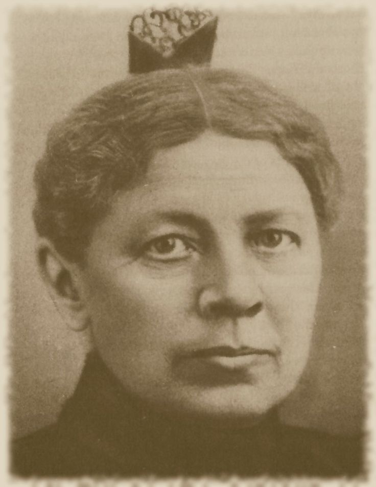 an old photo of a woman with a crown on her head