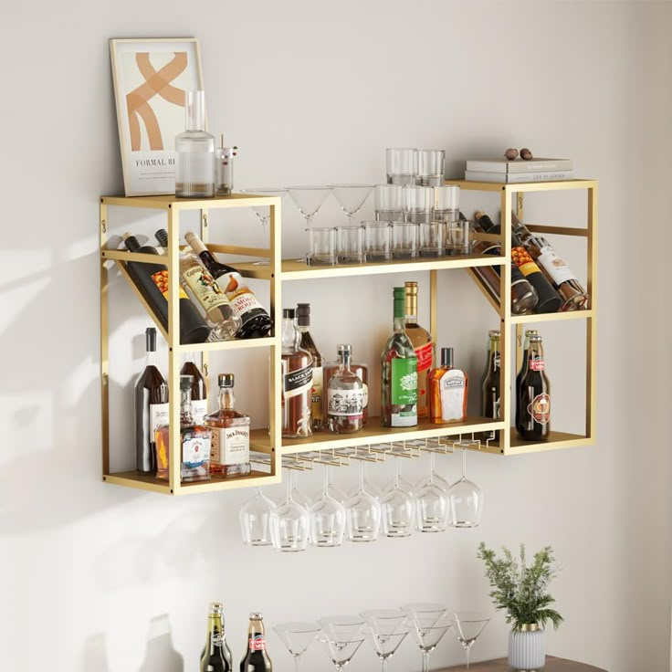 a shelf filled with wine glasses and liquor bottles