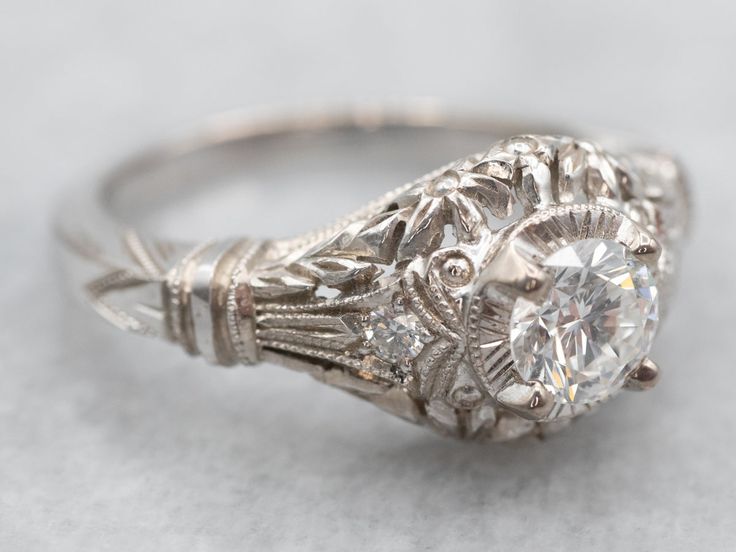 an antique diamond ring with filigree details