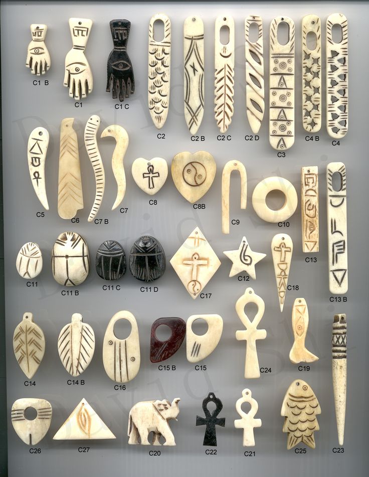 an assortment of carved wooden objects on display