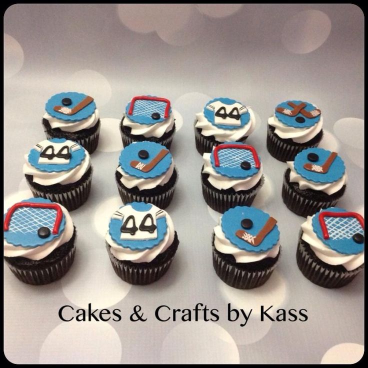 cupcakes decorated like cars and tennis rackets are arranged on a white table