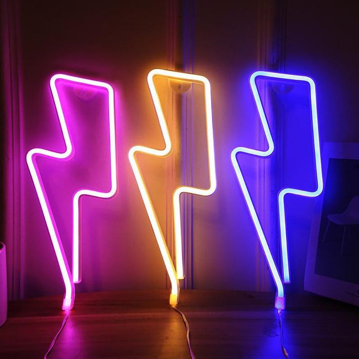 three neon lights that are next to each other