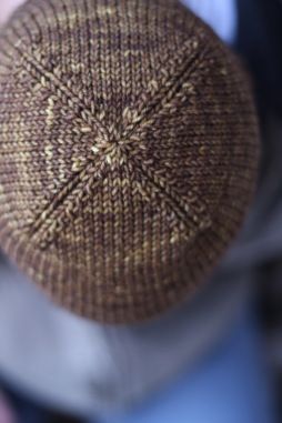 a close up view of a person's hat