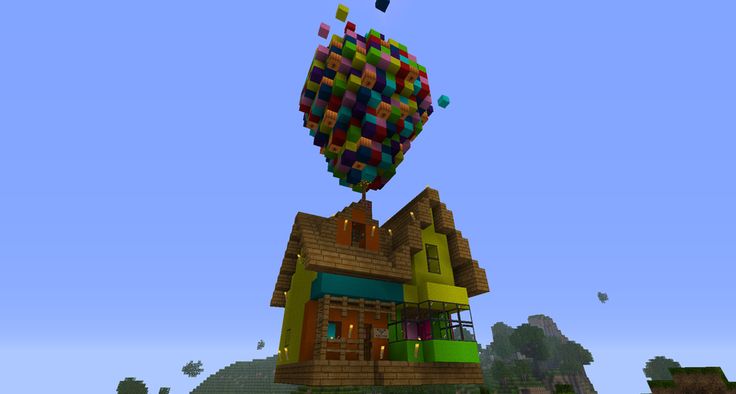 an image of a house in the air with lots of cubes on it's roof