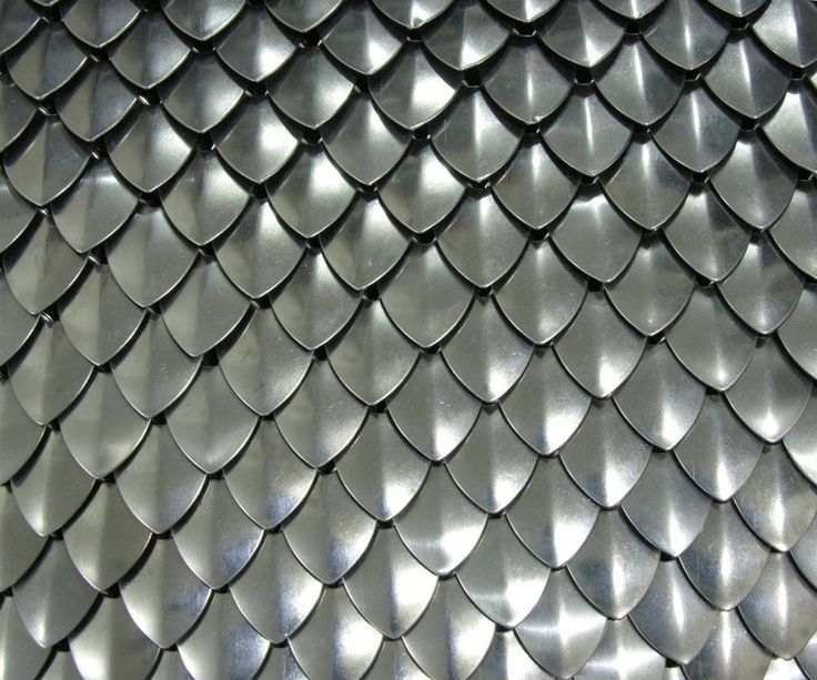 an image of a metal surface with fish scales on it's backgroung