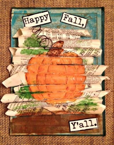 an art project made out of newspaper strips and paper with the words happy fall written on it