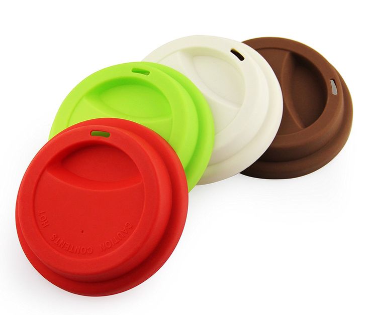 three different colored cups sitting next to each other on a white surface with the lids off