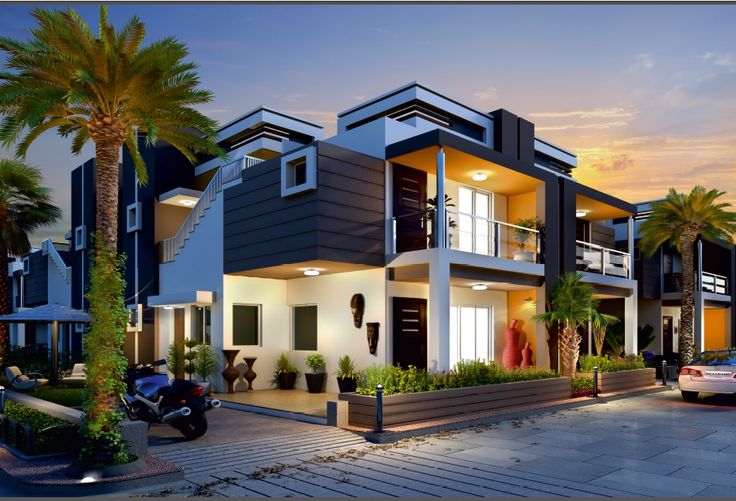 two story house with balconies and palm trees in the front yard at dusk