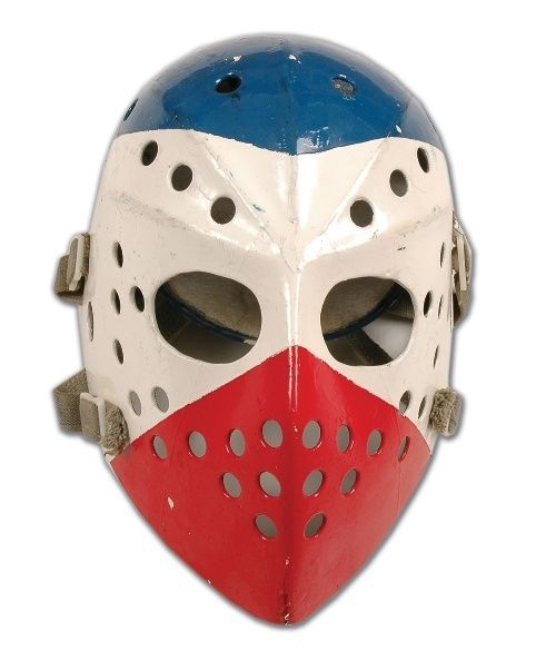 a red, white and blue mask with holes