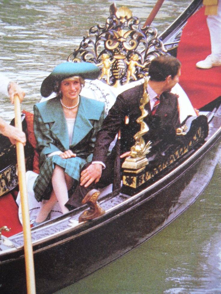 the prince and princess are riding in a gondola with two people on it