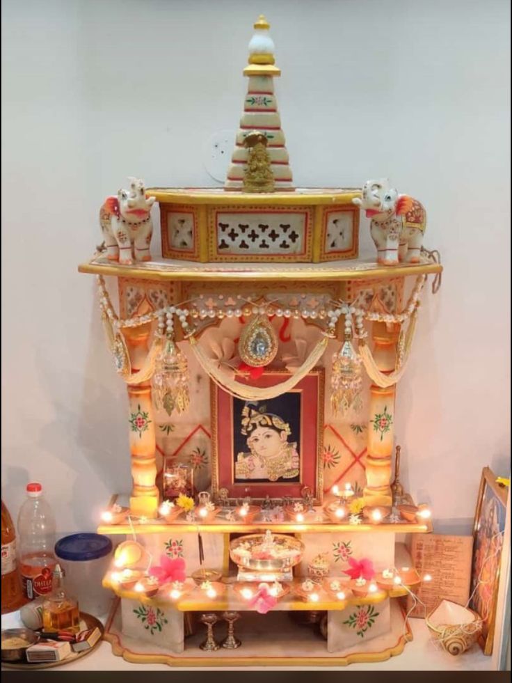 an elaborate shrine with candles and decorations