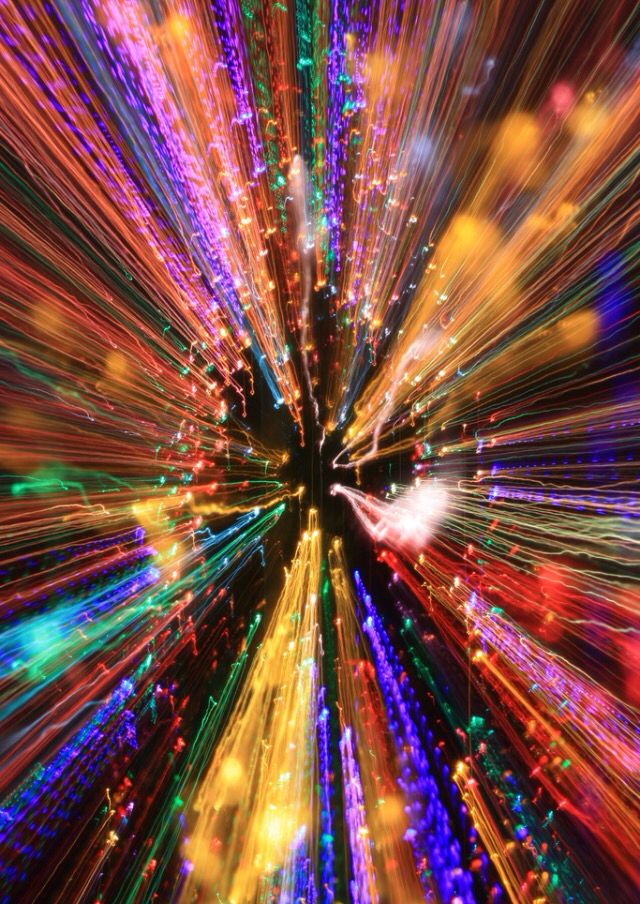 an image of colorful lights in the night sky with long exposure and blurry lines