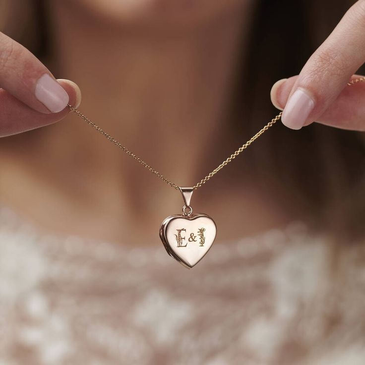 "Our Floral Wedding Initials Heart Locket makes a stunning gift for any happy couple. The design features a beautiful engraved floral design interwinted around your chosen initials. Choose from two initials with an ampersand in the middle. Personalise the back of the locket with a special date or word. This necklace makes the perfect wedding, anniversary, or special birthday gift. Handmade in our Brighton studio from the finest sterling silver. *We can now print your chosen photos in-house and m Wedding Heart Pendant Jewelry With Engraving Option, Heart Pendant Wedding Jewelry With Engraving Option, Heart Pendant Jewelry With Engraving Option For Weddings, Wedding Jewelry With Engraving Option, Heart Pendant, Valentine's Day Rose Gold Wedding Gift Necklace, Valentine's Day Wedding Gift Rose Gold Necklace, Rose Gold Necklace For Wedding, Valentine's Day Gift, Rose Gold Necklace For Wedding Gift On Valentine's Day, Heart-shaped Engraved Wedding Jewelry