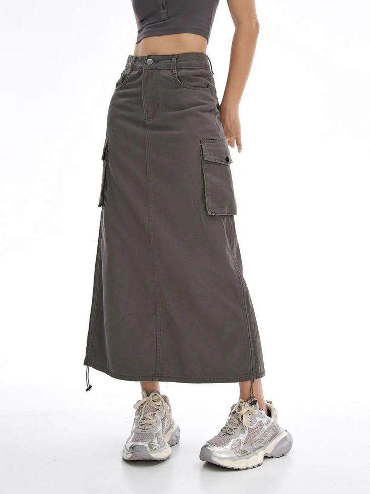 Introducing Our Latest Arrival Elevate your summer wardrobe with our New Cargo Long Skirt – a perfect blend of comfort, style, and versatility. This casual drawstring skirt with pockets is designed for the modern woman who values both fashion and functionality. Key Features Empire Waistline for a flattering fit Mid-Calf Length – the ideal balance of modesty and trendiness No-Nonsense Decoration – embrace simplicity with a clean look A-Line Silhouette for a graceful and timeless appeal Solid Patt Gray Lined Skirt, Summer Skirt With Cargo Pockets, Gray Skirt Outfit Casual, Cargo Long Skirt, Gray Skirt Outfit, Skirt Outfit Casual, Drawstring Skirt, Empire Waistline, Skirt With Pockets