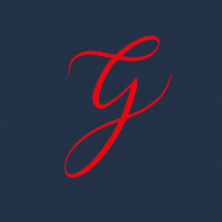 the letter g is drawn in red on a dark blue background, and it appears to be cursive