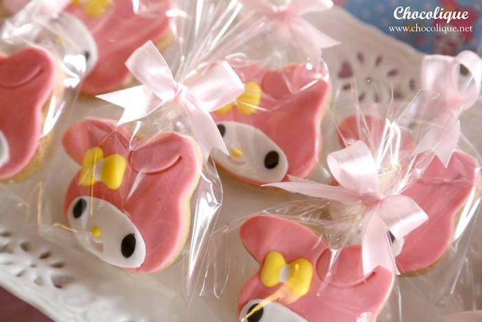 hello kitty decorated cookies in pink and white for a baby shower or birthday party with bows