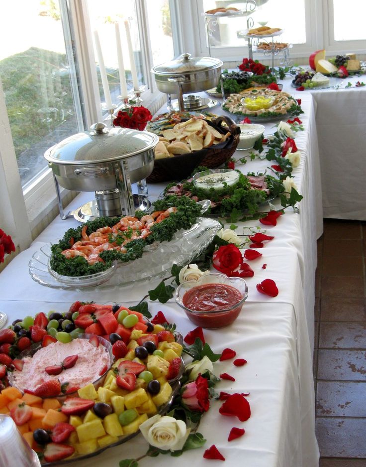 a long table with many different foods on it