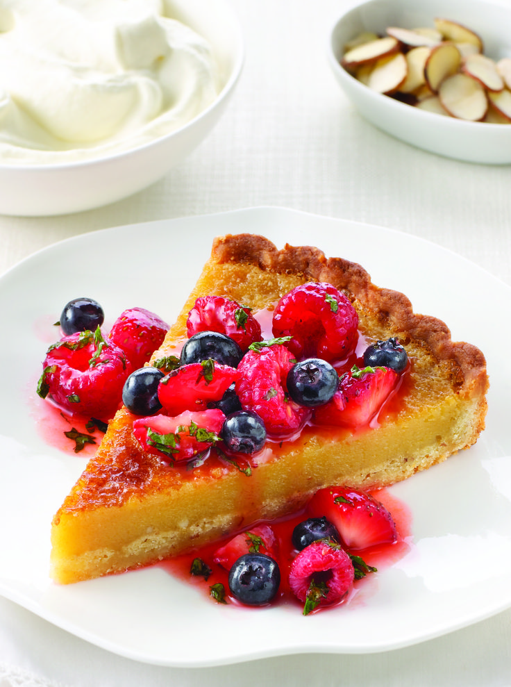 a slice of pie with berries on top