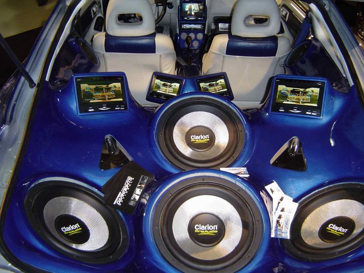 the inside of a car with several speakers in it