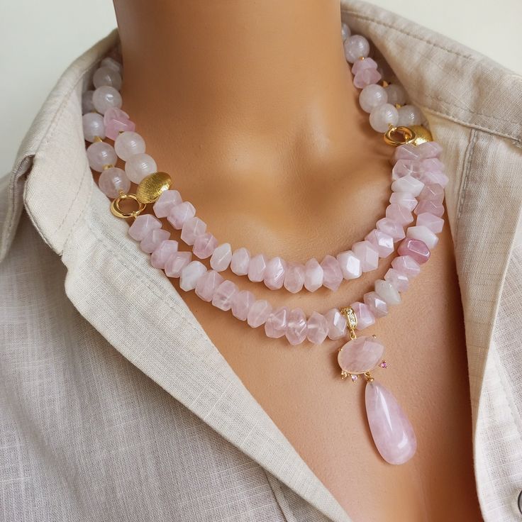 Enhance your boho style with this stunning Pink Quartz Necklace. This stunning natural stone beaded necklace features a pendant made of beautiful pink quartz gemstone that radiates positive energy and feminine elegance. Perfect for everyday wear or special occasions, this unique quartz jewelry makes a thoughtful gift for women who appreciate natural beauty and elegant appeal. MATERIALS: Pink Quartz gemstones: These genuine gemstones, extracted from the depths of the earth, add depth and mystery Pink Pendant Crystal Necklace With Natural Stones, Bohemian Pink Crystal Necklaces With Faceted Beads, Bohemian Pink Crystal Necklace With Gemstone Beads, Bohemian Pink Crystal Necklace With Faceted Beads, Pink Bohemian Crystal Necklace With Gemstone Beads, Pink Bohemian Crystal Necklace With Faceted Beads, Pink Rose Quartz Crystal Necklace With Natural Stones, Bohemian Pink Rose Quartz Jewelry, Rose Quartz Pendant Necklace With Natural Stones