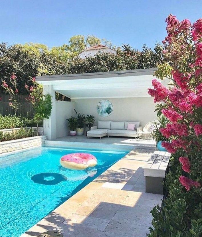 a pool with an inflatable mattress sitting next to it