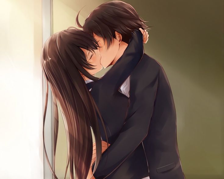 a man and woman are kissing in front of a mirror with long hair on their heads