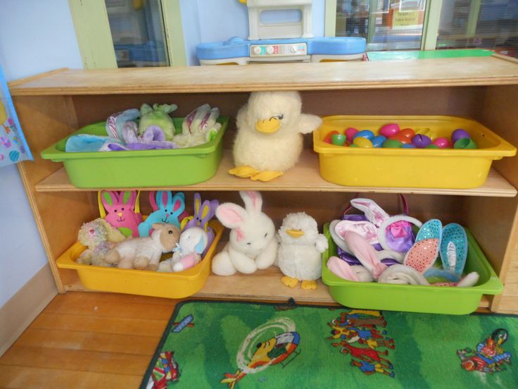 the shelves are filled with plastic easter eggs and stuffed animals in their bins on the floor