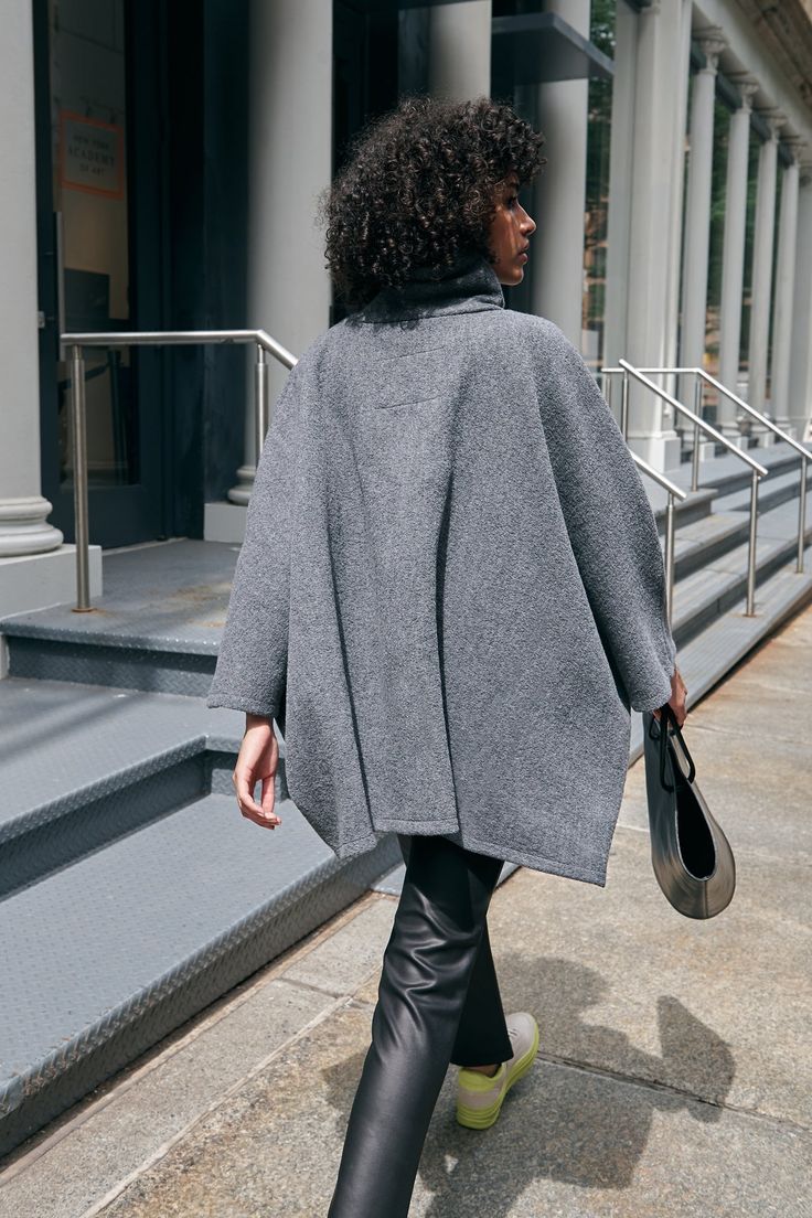 A stylish wool winter cloak, our Avery Cape is the ideal choice for heading out into the cold. Fashioned from Italian virgin wool and offered in fresh neutrals that pair well with any combination of clothing, this women’s wool cape is designed with a loose silhouette. Simple. Elegant. Cozy. Layer her over anything for an instant ready-to-go look. Avery's high collar has a side zipper for style and easy wear. This wool winter cape is lined for added warmth and comfort. | Astrid, in medium grey an Cape Clothing, Winter Cloak, Cape Outfit, Winter Cape, Cape Jacket, Wool Cape, Custom Dress, Wool Winter, Cape Coat